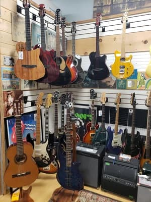 Instruments lining the walls at Big Island Guitars, home of the First Saturday jam