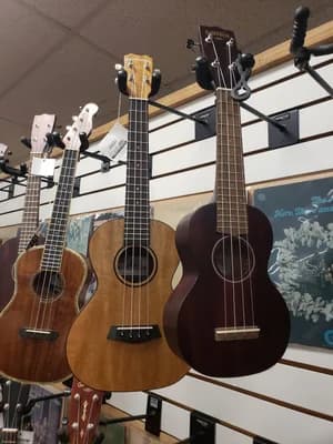 Guitars and gear filling the shop floor at Big Island Guitars in Hilo